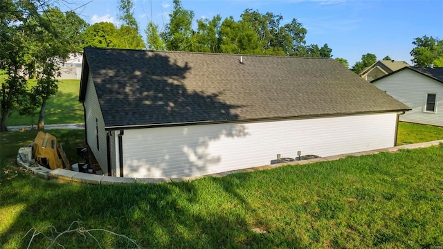 view of side of property with a lawn