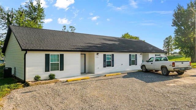 ranch-style home featuring cooling unit