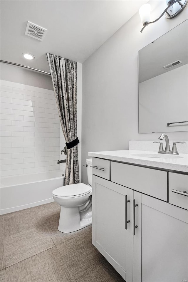 full bath featuring shower / tub combo, visible vents, vanity, and toilet