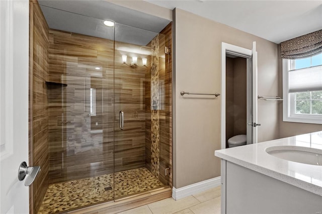 bathroom featuring vanity, baseboards, a sauna, tile patterned floors, and a stall shower