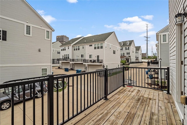 wooden deck with a residential view