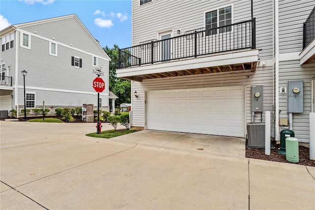 exterior space with central AC and driveway