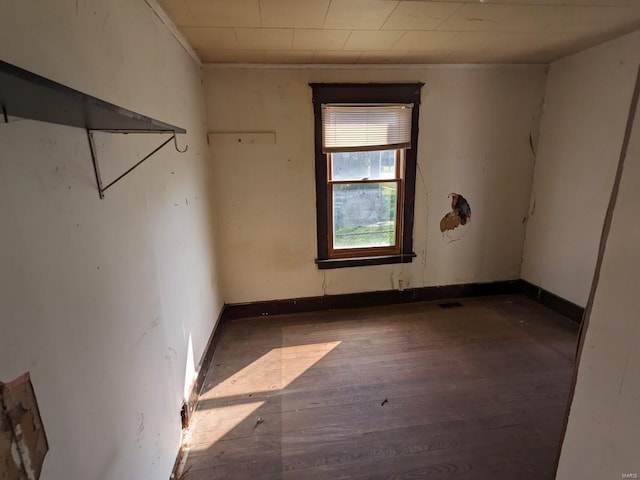 empty room with dark wood-type flooring