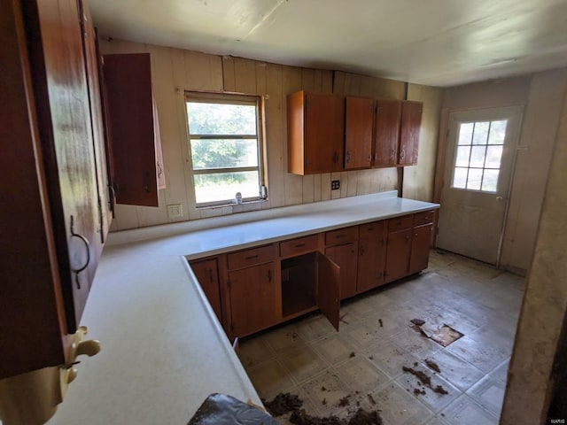 kitchen featuring wooden walls