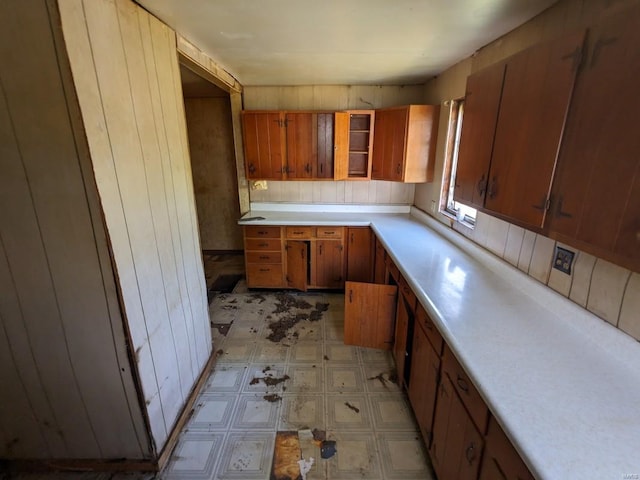 kitchen featuring wooden walls