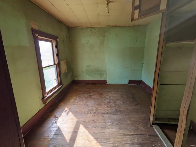 spare room featuring dark hardwood / wood-style floors