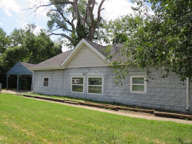 view of front of property with a gazebo, a shingled roof, and a front yard