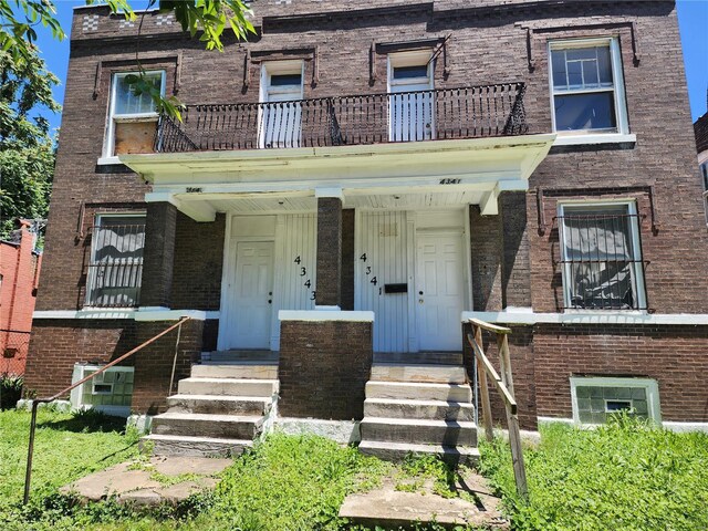 view of property with a balcony