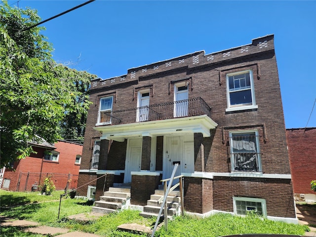 view of front of house with a balcony