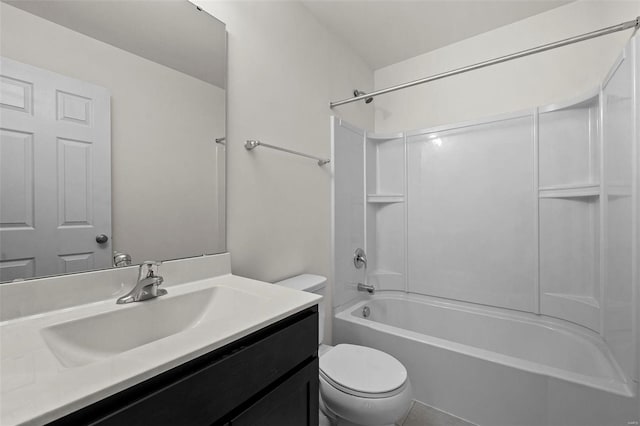 full bathroom with toilet, vanity, and tub / shower combination