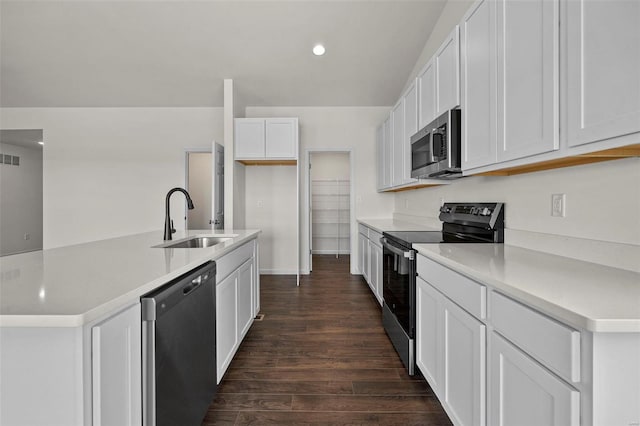 kitchen featuring sink, dark hardwood / wood-style flooring, white cabinetry, and stainless steel appliances