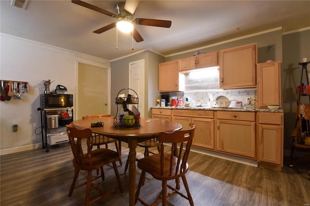 dining room featuring ceiling fan, dark hardwood / wood-style floors, and ornamental molding