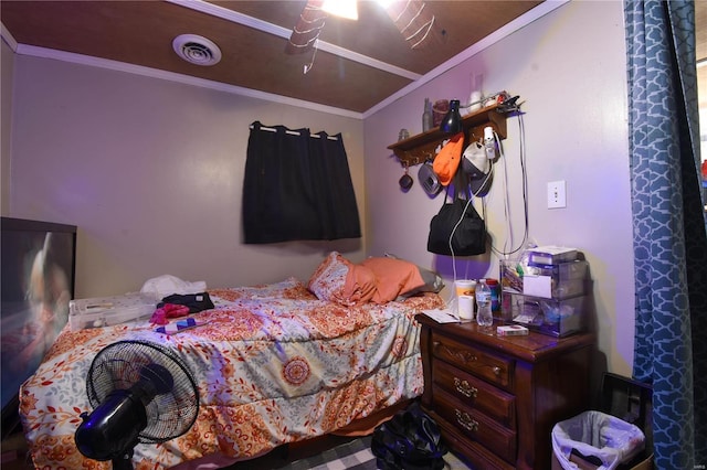 bedroom with ceiling fan and ornamental molding