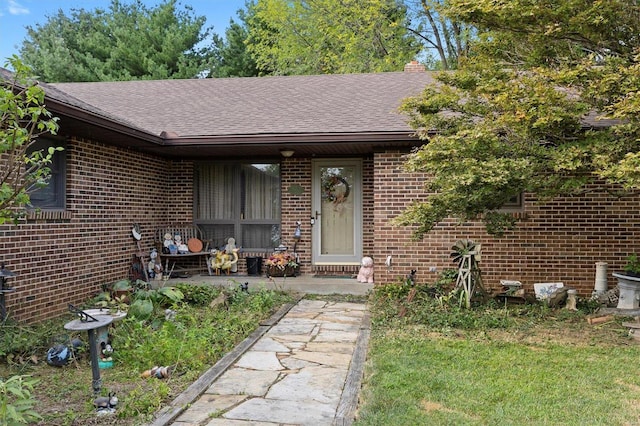 view of front of house with a front lawn and a patio area