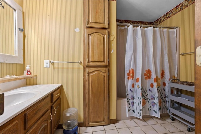 bathroom with shower / tub combo with curtain, vanity, and tile patterned floors