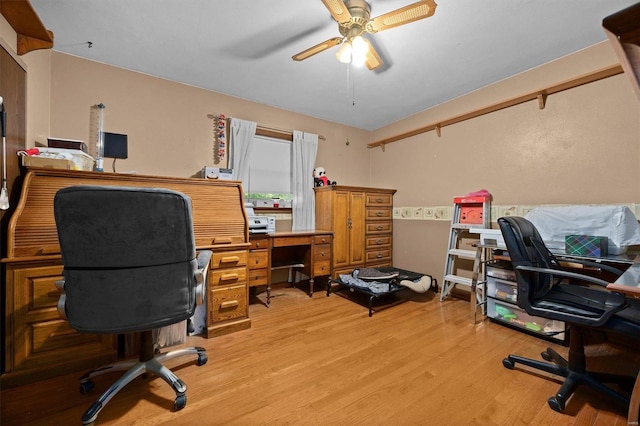 office with ceiling fan and light hardwood / wood-style floors