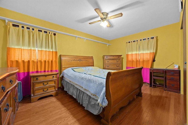 bedroom featuring hardwood / wood-style floors and ceiling fan