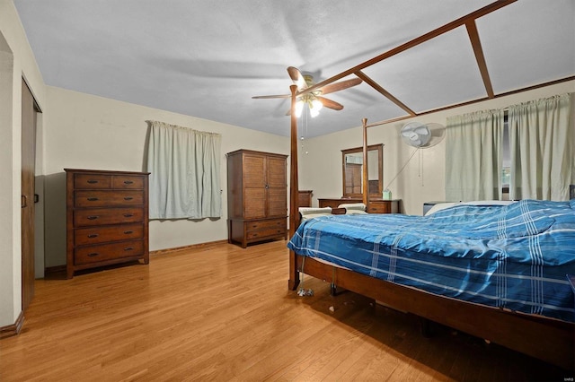 bedroom with ceiling fan and light wood-type flooring