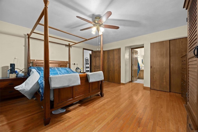 bedroom with ceiling fan, connected bathroom, and light hardwood / wood-style floors