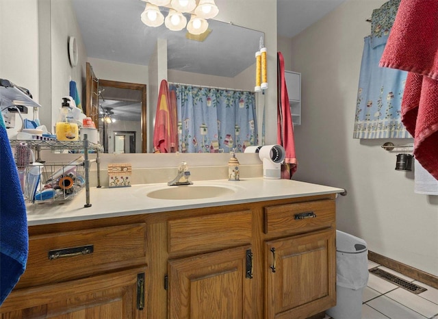 bathroom featuring tile patterned floors, vanity, and walk in shower