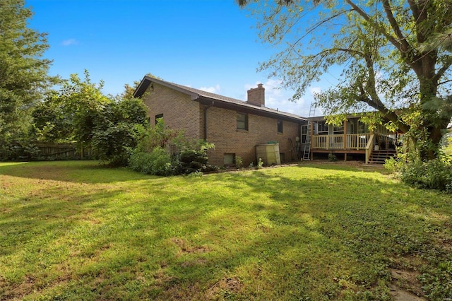 view of yard with a wooden deck