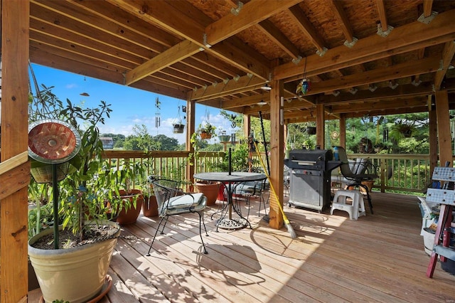 wooden terrace featuring a grill