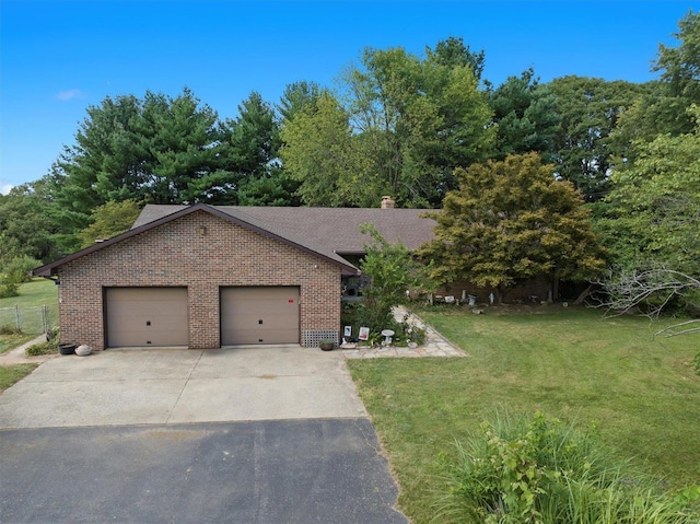 view of front facade featuring a front yard and a garage