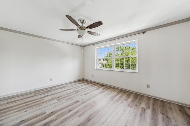 unfurnished room featuring crown molding, ceiling fan, and light hardwood / wood-style floors