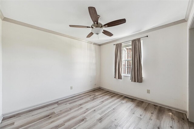 empty room featuring ceiling fan, light hardwood / wood-style flooring, and ornamental molding