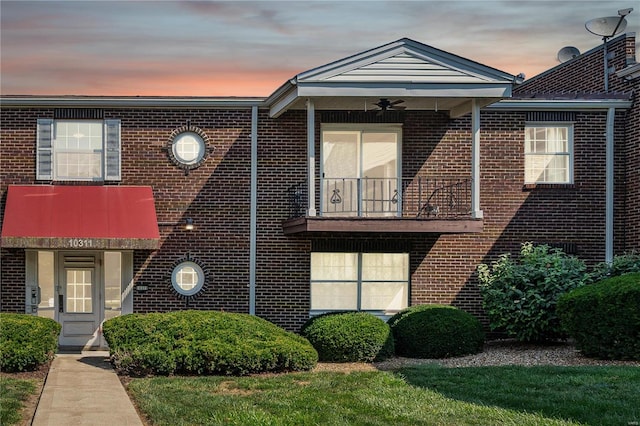 view of front of house with a balcony