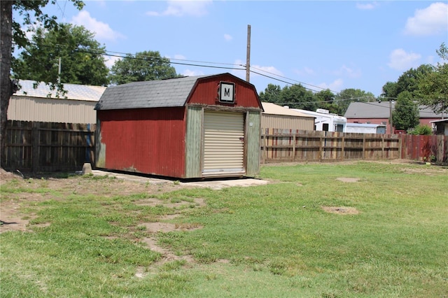 view of outbuilding with a lawn