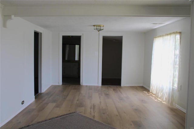 unfurnished room featuring light wood-type flooring