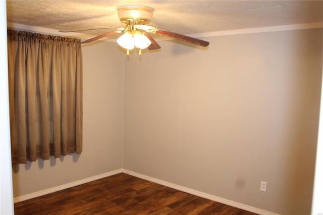 unfurnished room featuring ceiling fan and dark hardwood / wood-style floors