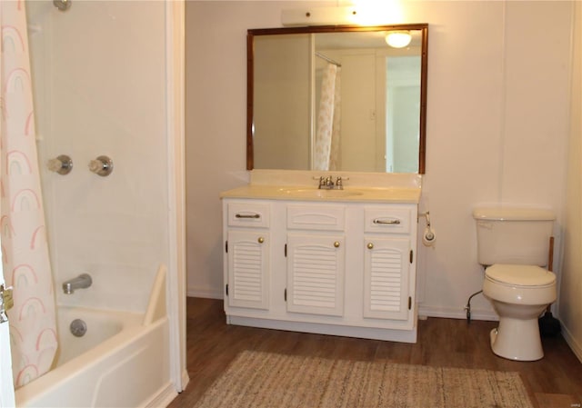 full bathroom with vanity, toilet, hardwood / wood-style floors, and shower / bath combo with shower curtain