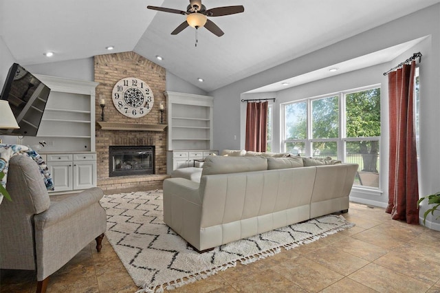 living area with built in shelves, recessed lighting, a ceiling fan, a brick fireplace, and vaulted ceiling