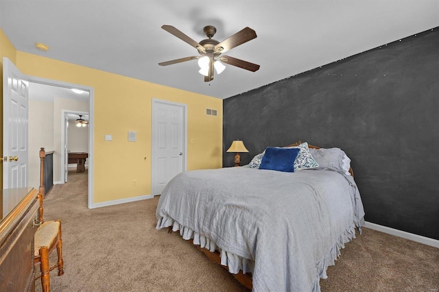 bedroom featuring ceiling fan and light colored carpet