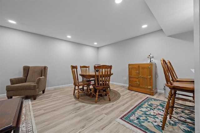 dining area featuring light wood-style floors and recessed lighting