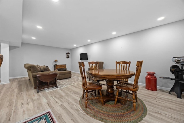 dining room featuring recessed lighting and light wood-style flooring