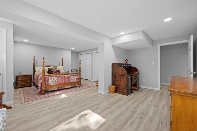 bedroom featuring light hardwood / wood-style flooring and a closet