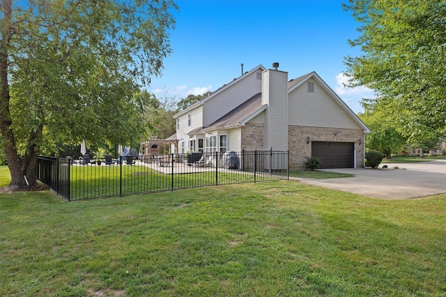 view of side of property with a garage, brick siding, fence, concrete driveway, and a lawn