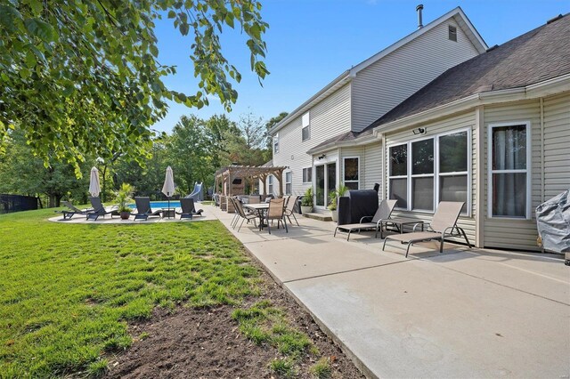 view of yard with a pergola and a patio area