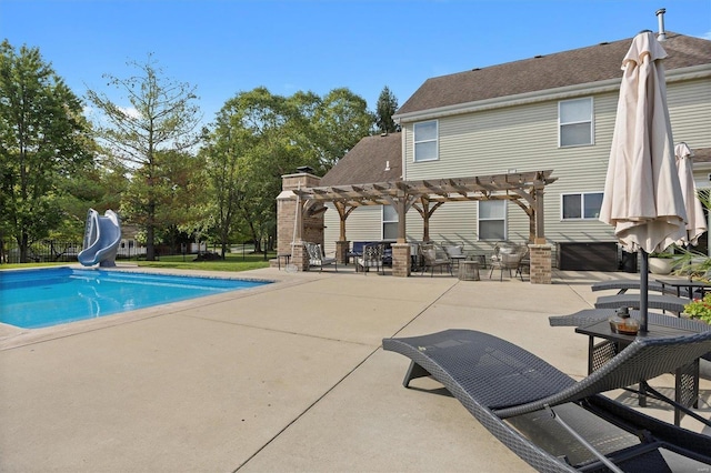 view of swimming pool featuring a fenced in pool, a patio, fence, a water slide, and a pergola