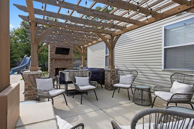 view of patio featuring a pergola and an outdoor brick fireplace