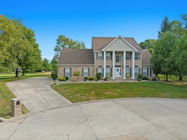 view of front of house with a front lawn