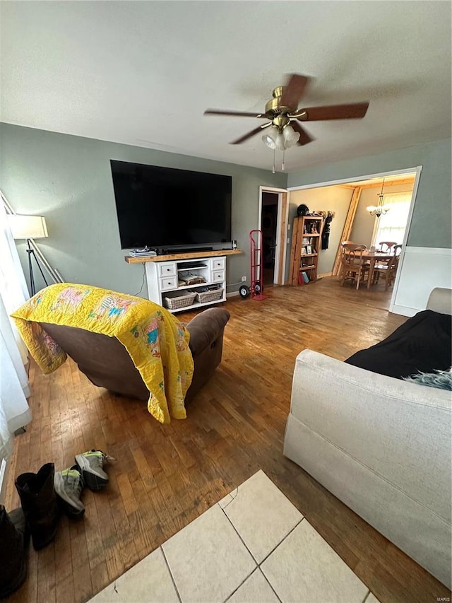 living room featuring ceiling fan and wood-type flooring