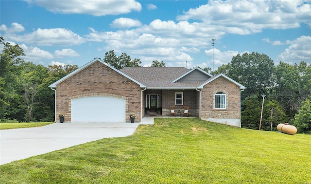 ranch-style home featuring an attached garage, brick siding, a shingled roof, concrete driveway, and a front lawn