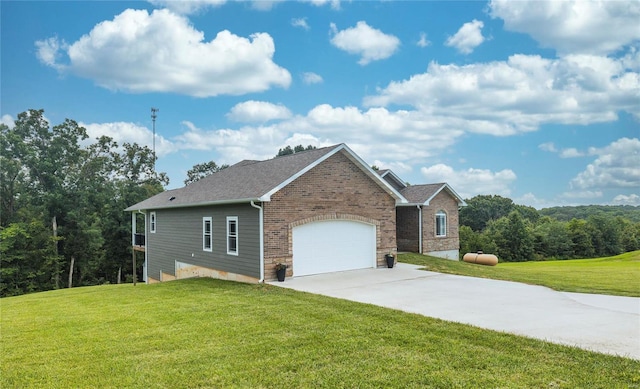 view of front of house featuring a garage and a front lawn