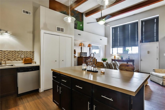 kitchen with beamed ceiling, dishwasher, ceiling fan, and hardwood / wood-style floors