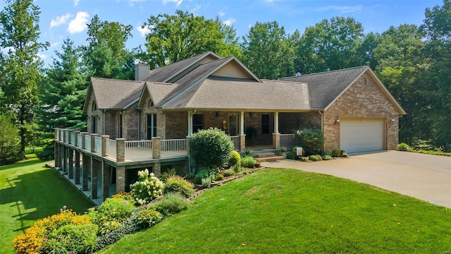 craftsman-style home featuring an attached garage, driveway, brick siding, and a front yard