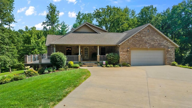 craftsman inspired home with driveway, a garage, a front lawn, a porch, and brick siding